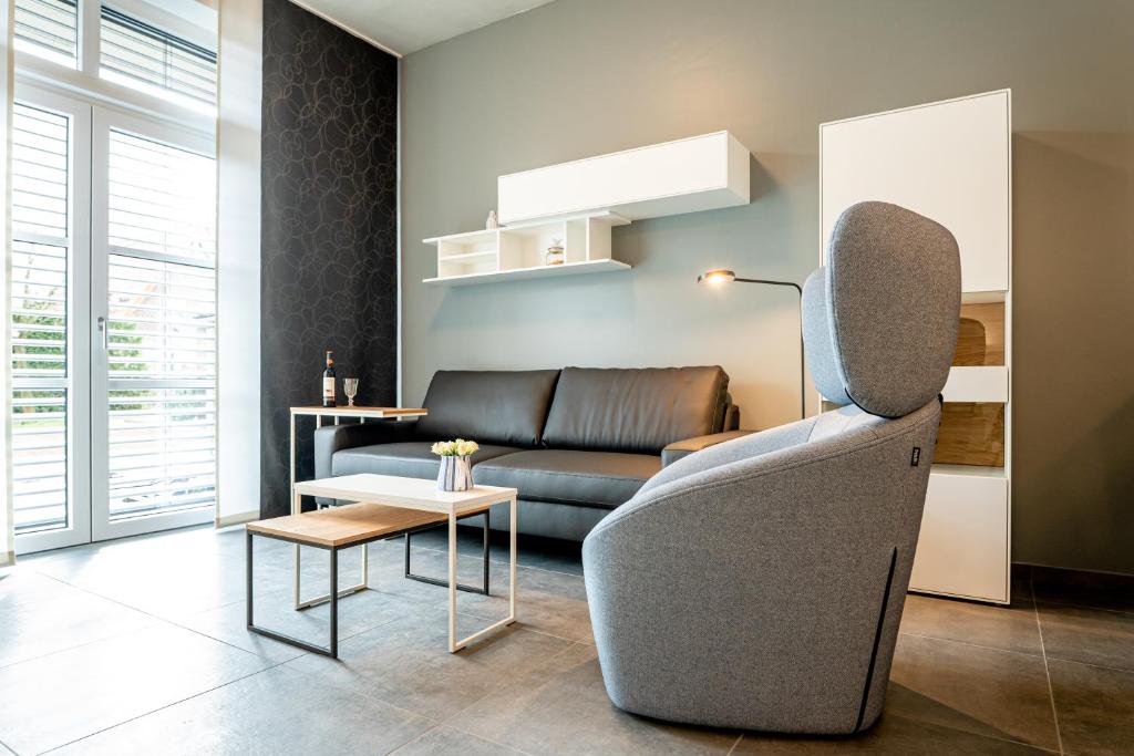 a living room with a couch and a table at Refugium am Wasserturm in Emsdetten