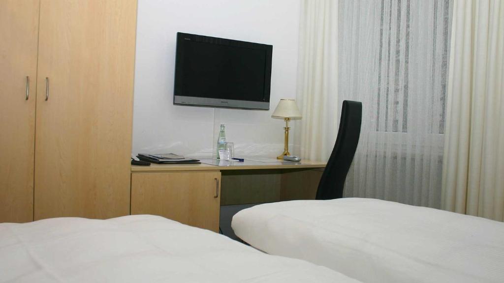 Postel nebo postele na pokoji v ubytování Hotel Occam