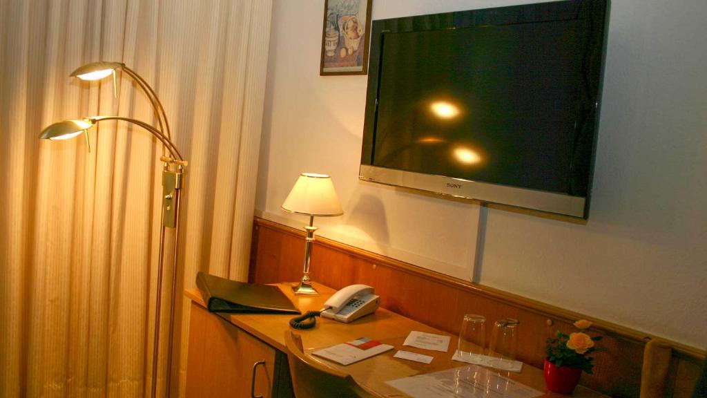 TV a/nebo společenská místnost v ubytování Hotel Occam