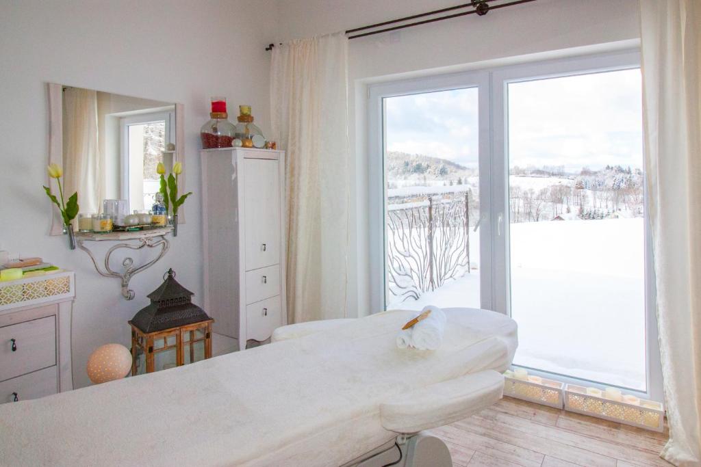 Posteľ alebo postele v izbe v ubytovaní Dwór i Dworek Leszczowate Wellness & Spa
