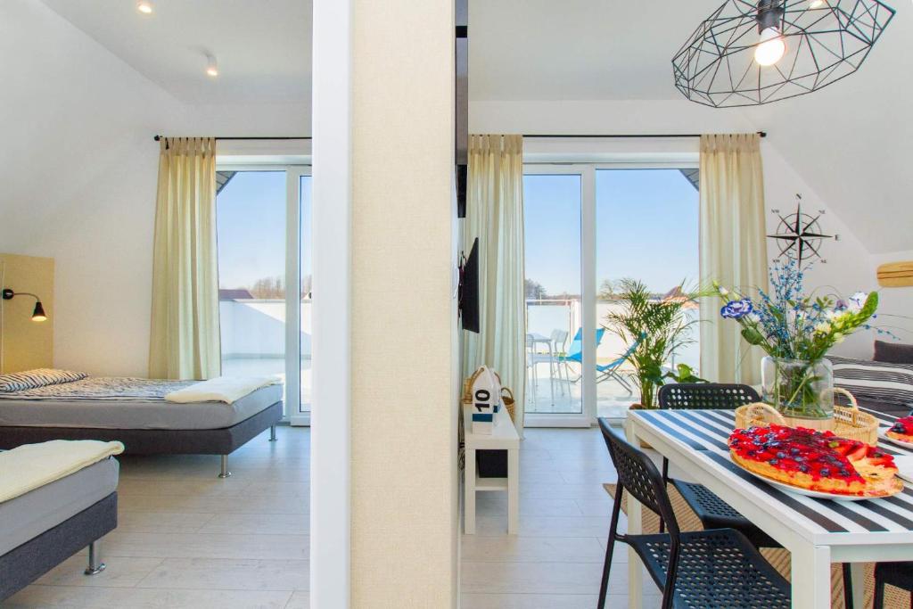 Posteľ alebo postele v izbe v ubytovaní Apartamenty Bałtyckie