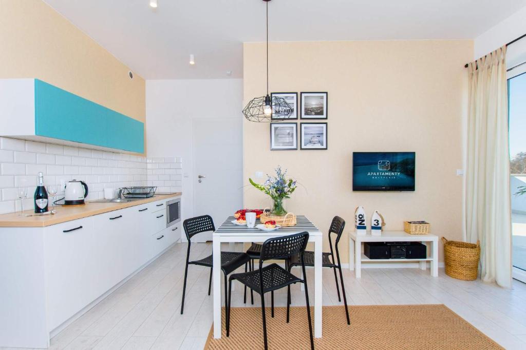 Kuchyňa alebo kuchynka v ubytovaní Apartamenty Bałtyckie