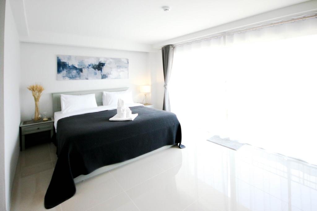 Postel nebo postele na pokoji v ubytování Tonkla Boutique Hotel