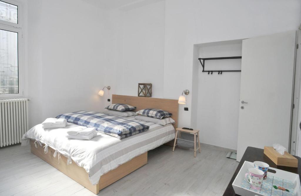 Łóżko lub łóżka w pokoju w obiekcie Guest House La Genesa