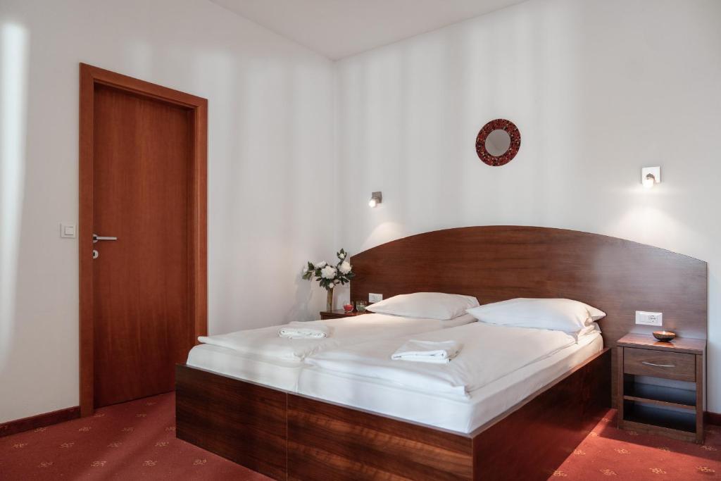 Postel nebo postele na pokoji v ubytování Hotel Medno