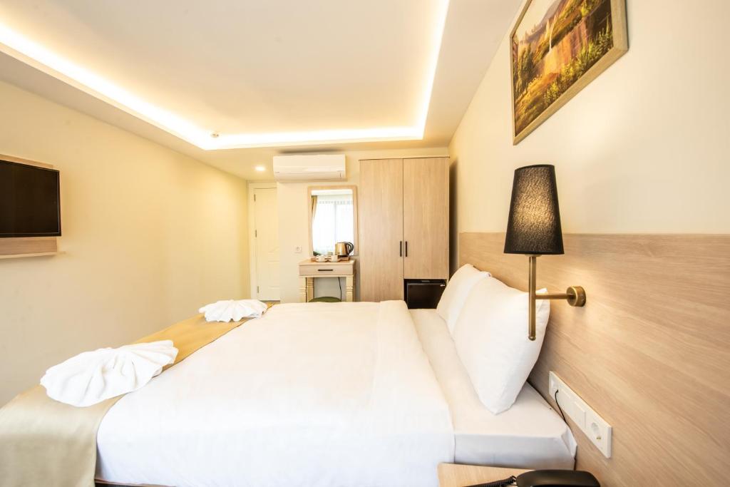 Postel nebo postele na pokoji v ubytování Royal Bosphorus Hotel & SPA Hamam