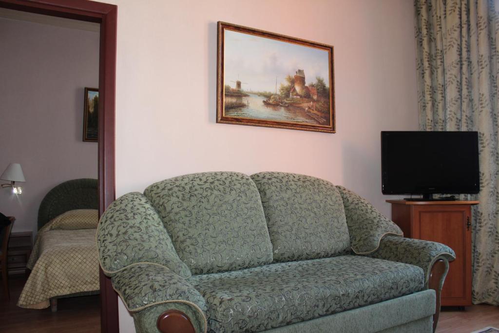TV a/nebo společenská místnost v ubytování Domus Hotel-1