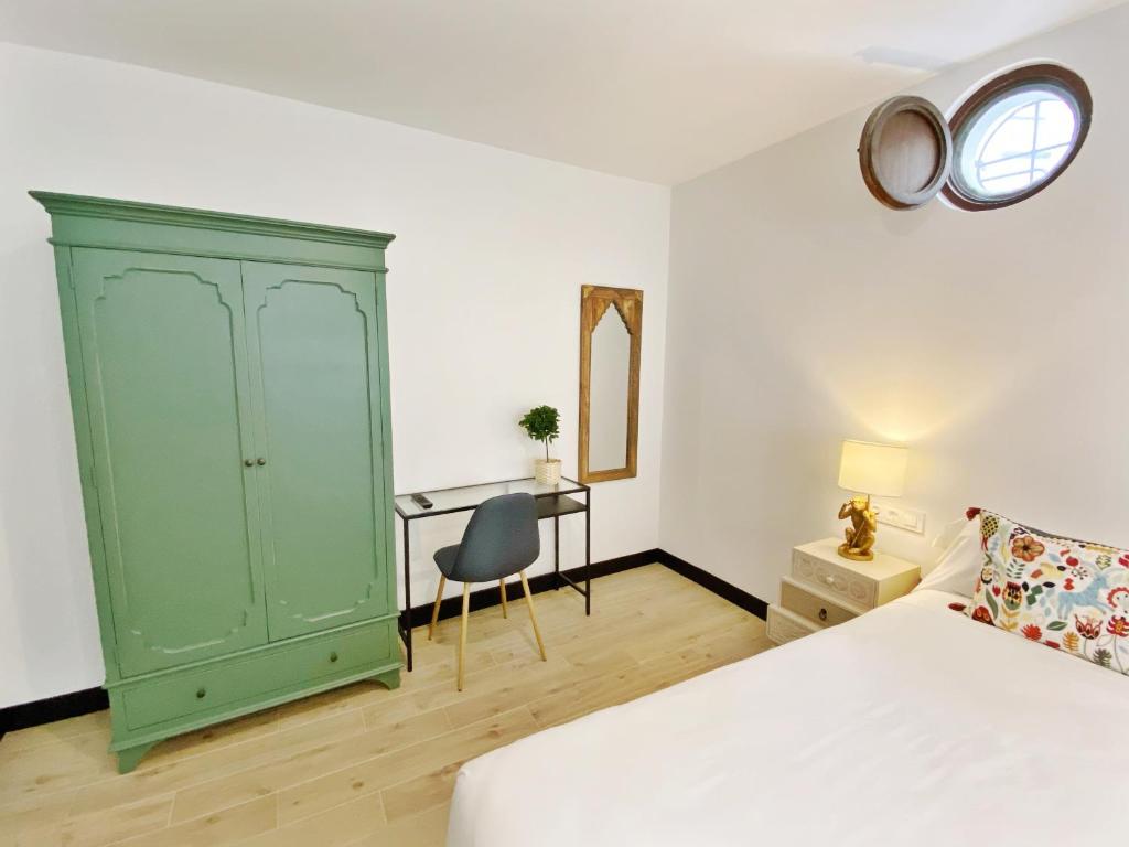 A bed or beds in a room at La SIGRINA Tuy