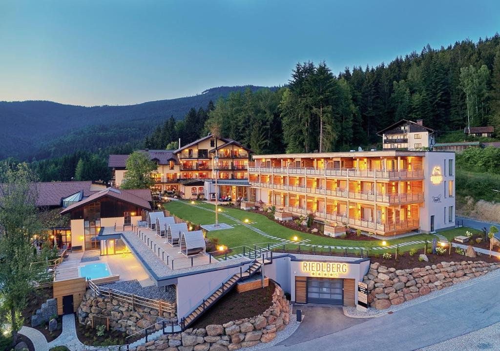 an aerial view of a hotel in the mountains at Wellnesshotel Riedlberg in Drachselsried