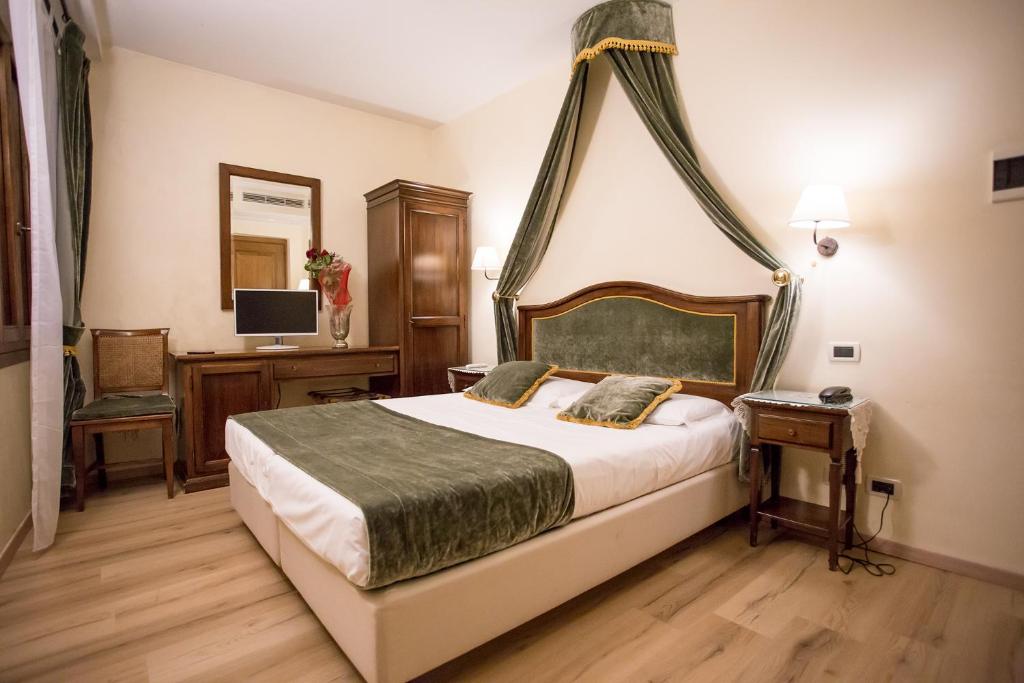 Postel nebo postele na pokoji v ubytování Residenza Rivo Alto
