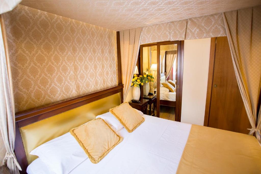 Postel nebo postele na pokoji v ubytování Residenza Rivo Alto