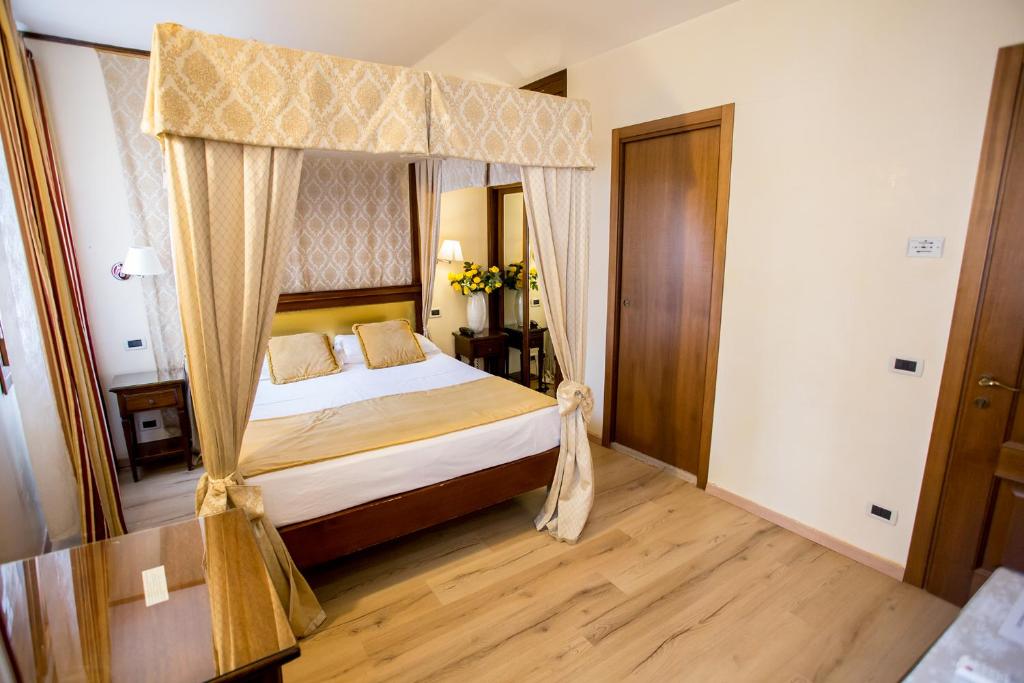 Postel nebo postele na pokoji v ubytování Residenza Rivo Alto