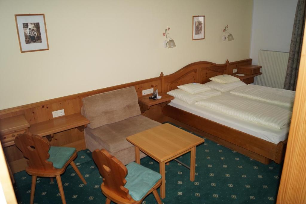 Postel nebo postele na pokoji v ubytování Hotel Sonne