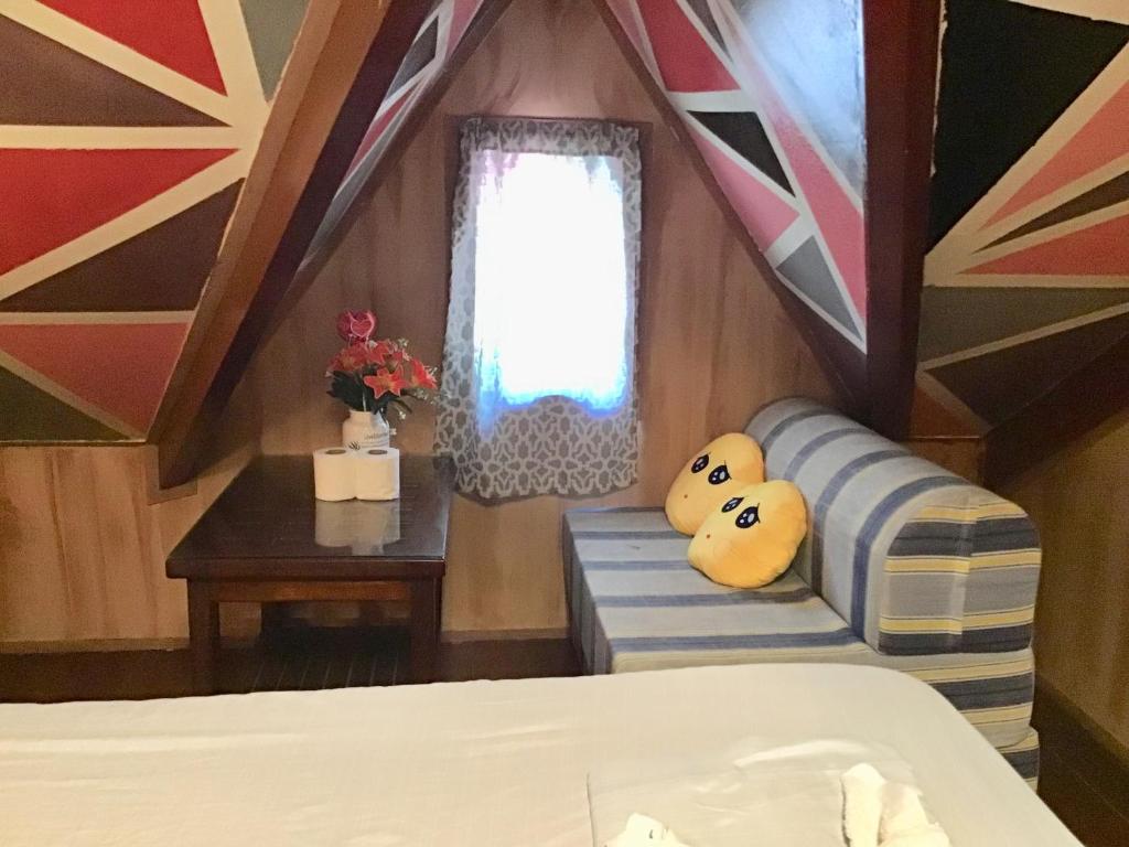 Postel nebo postele na pokoji v ubytování Ferranco Tourist Inn