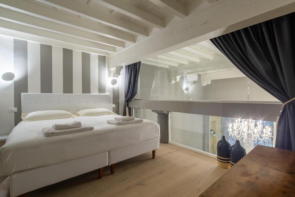 Posteľ alebo postele v izbe v ubytovaní Casa Velluti Deluxe by Mmega