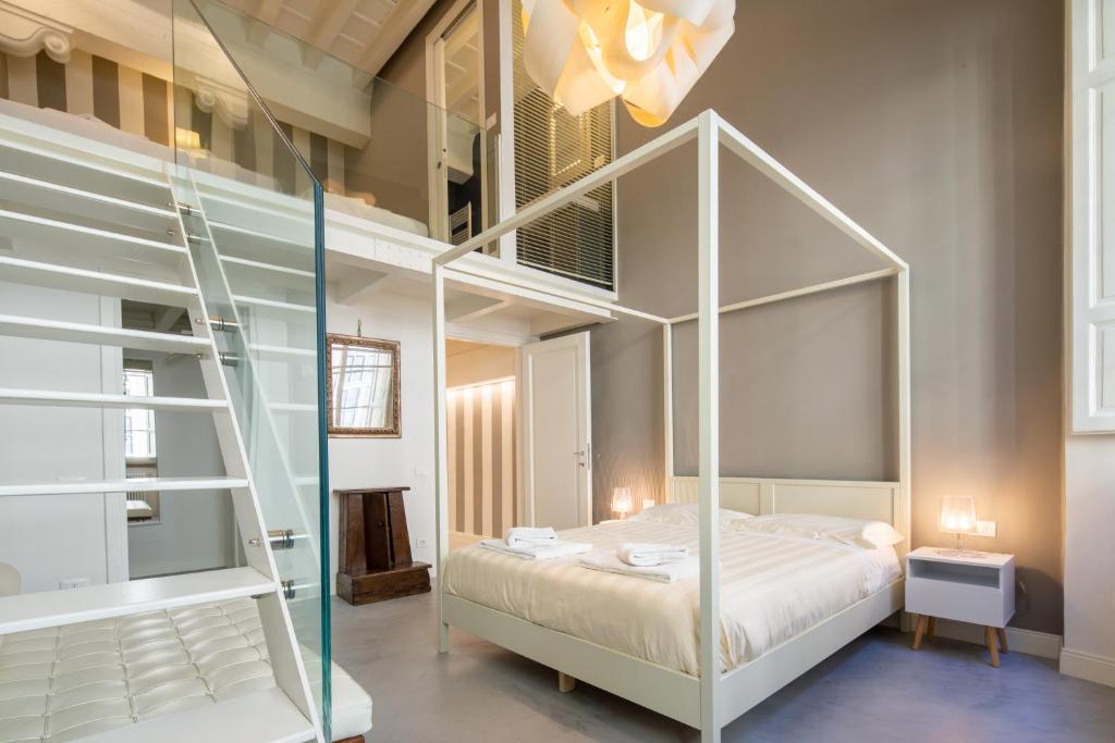 Posteľ alebo postele v izbe v ubytovaní Casa Velluti Deluxe by Mmega