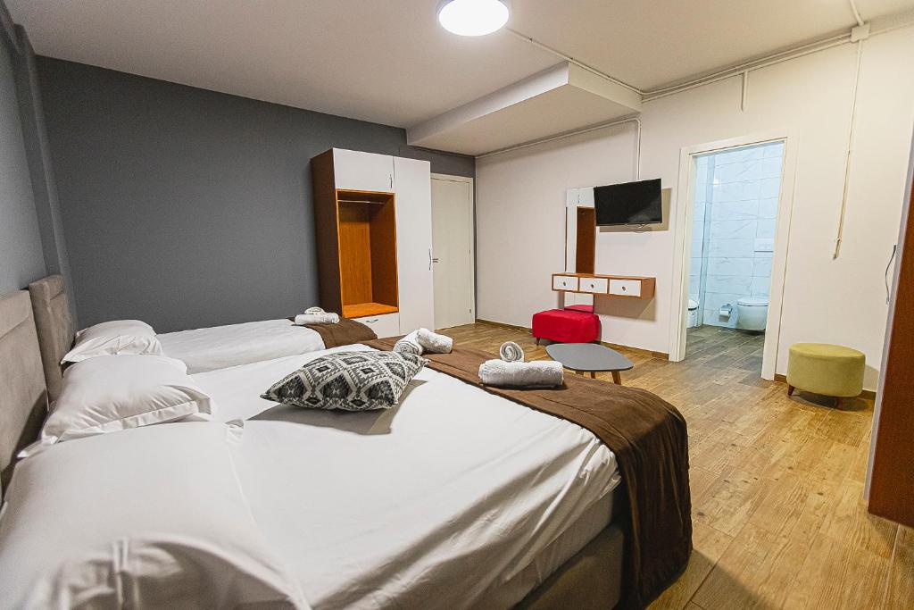 Postel nebo postele na pokoji v ubytování Olivar Hotel Tirana