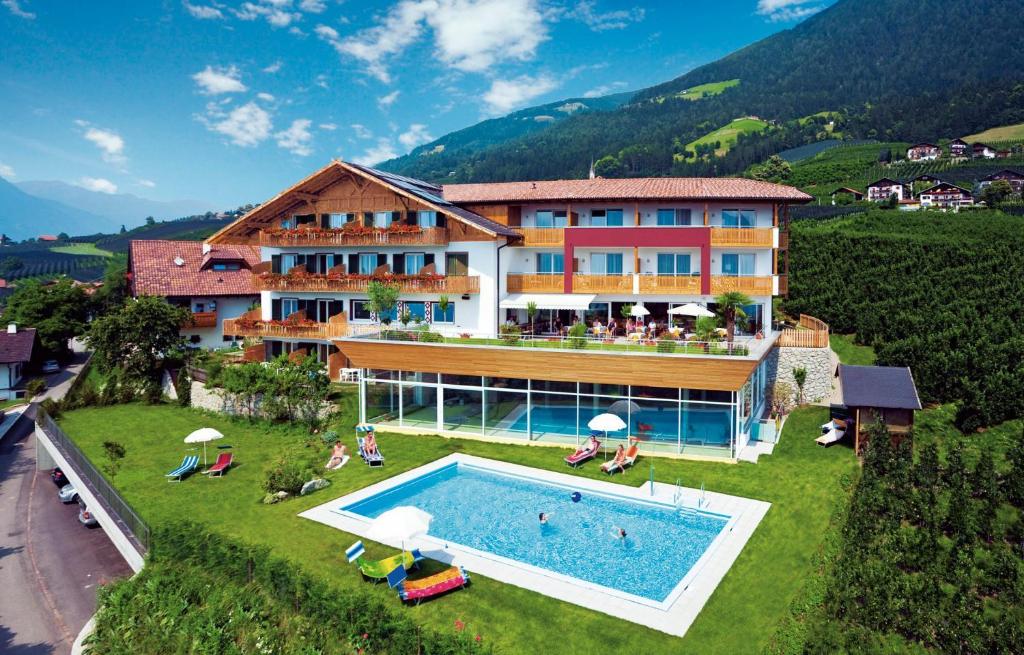an aerial view of a hotel with a swimming pool at Garni Kleefeld in Schenna
