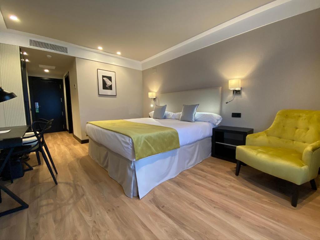 Hotel Parque Real tesisinde bir odada yatak veya yataklar