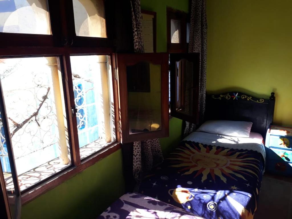 Una cama o camas en una habitación de Harmony Hotel