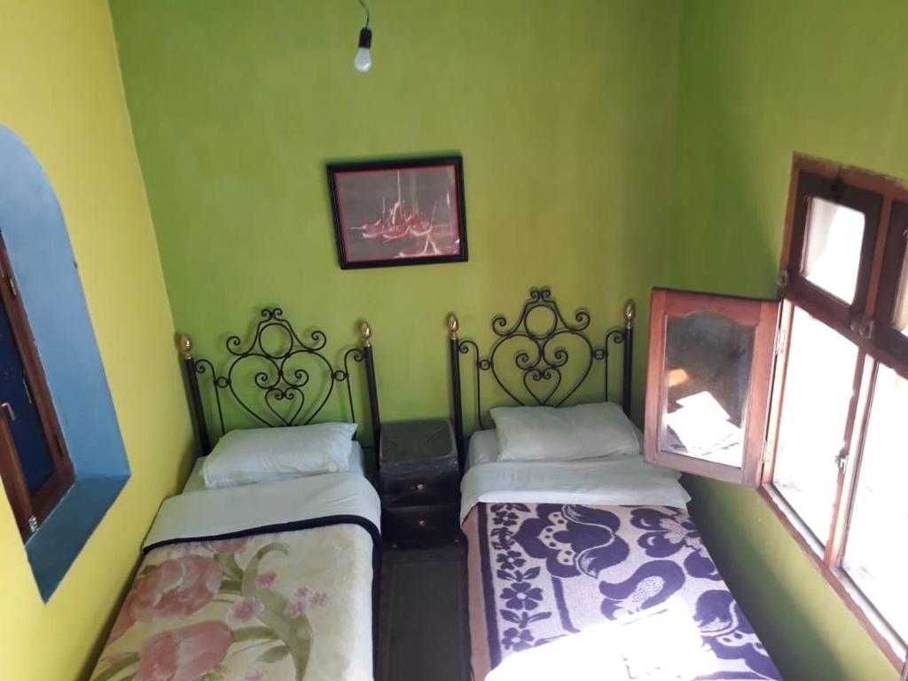 Una cama o camas en una habitación de Harmony Hotel