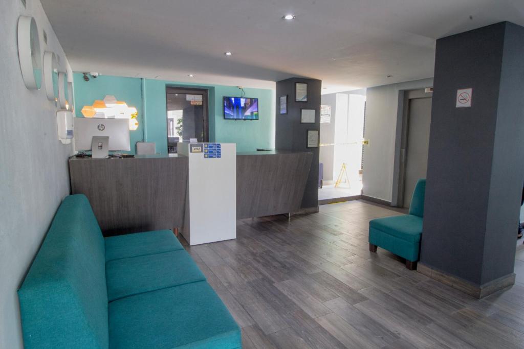 TV a/nebo společenská místnost v ubytování Hotel Flamingo Merida