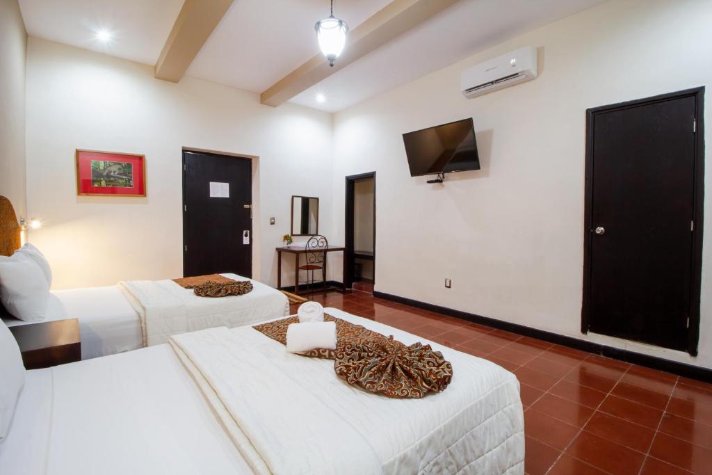 Postel nebo postele na pokoji v ubytování Hotel Merida
