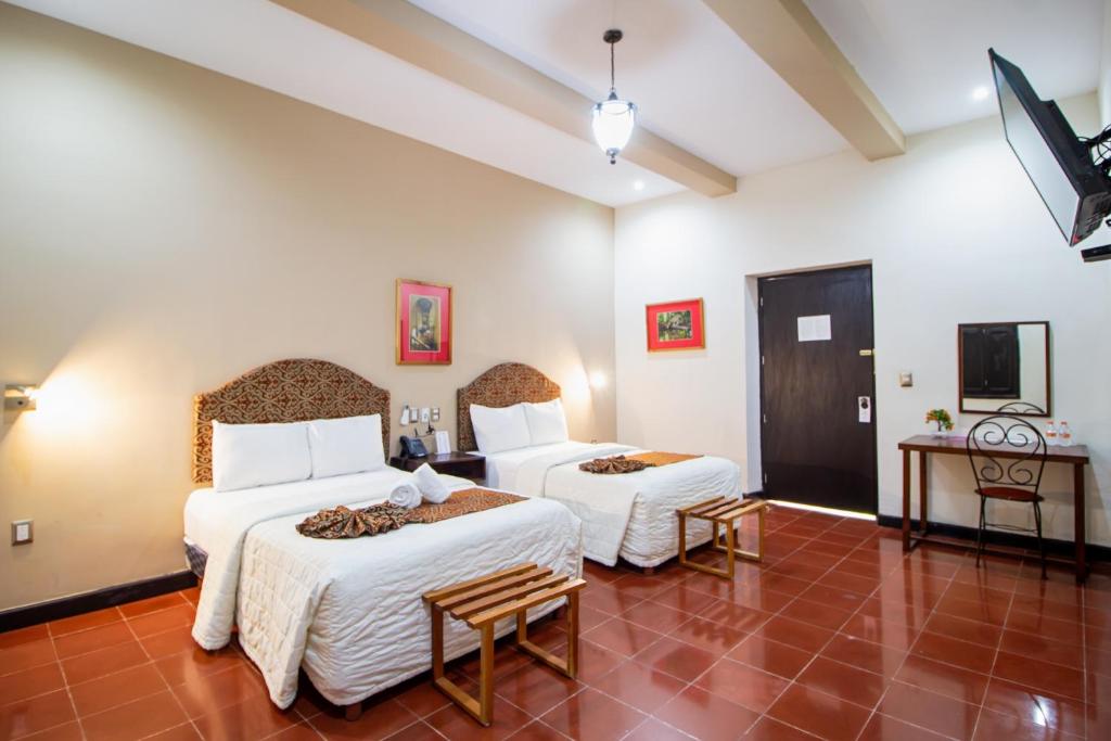 TV a/nebo společenská místnost v ubytování Hotel Merida
