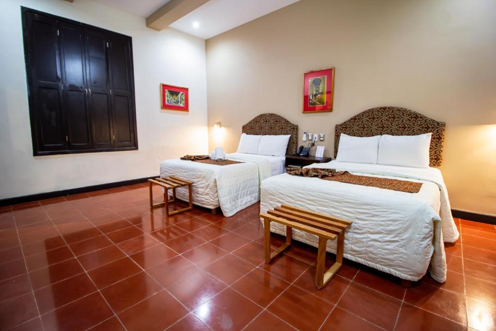 Postel nebo postele na pokoji v ubytování Hotel Merida