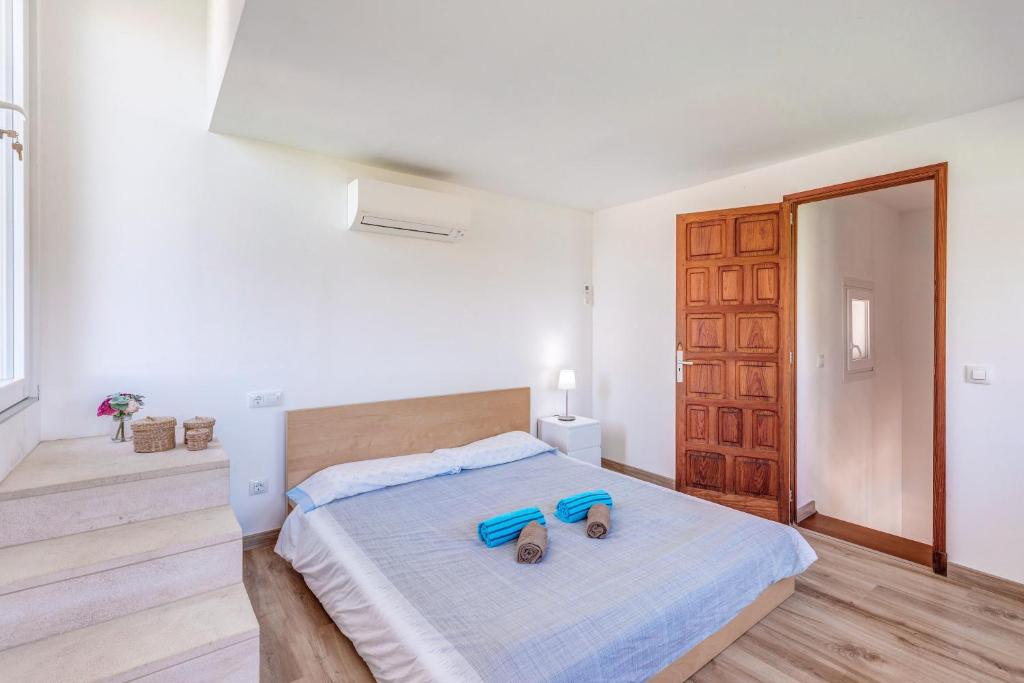 Postel nebo postele na pokoji v ubytování Villa Dos Mundos