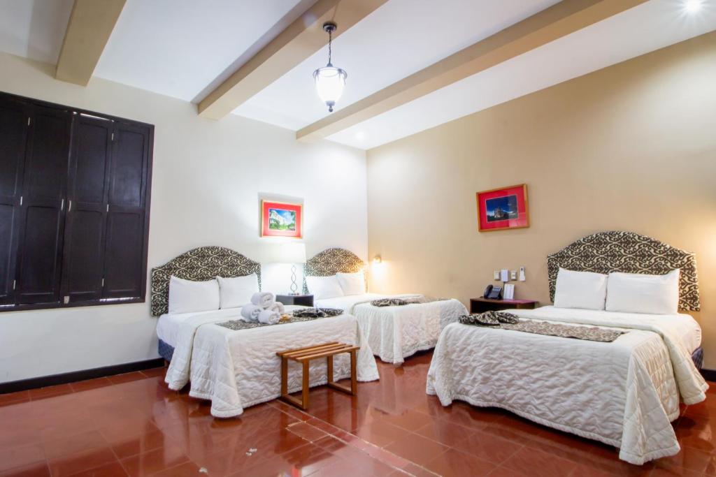 Postel nebo postele na pokoji v ubytování Hotel Merida