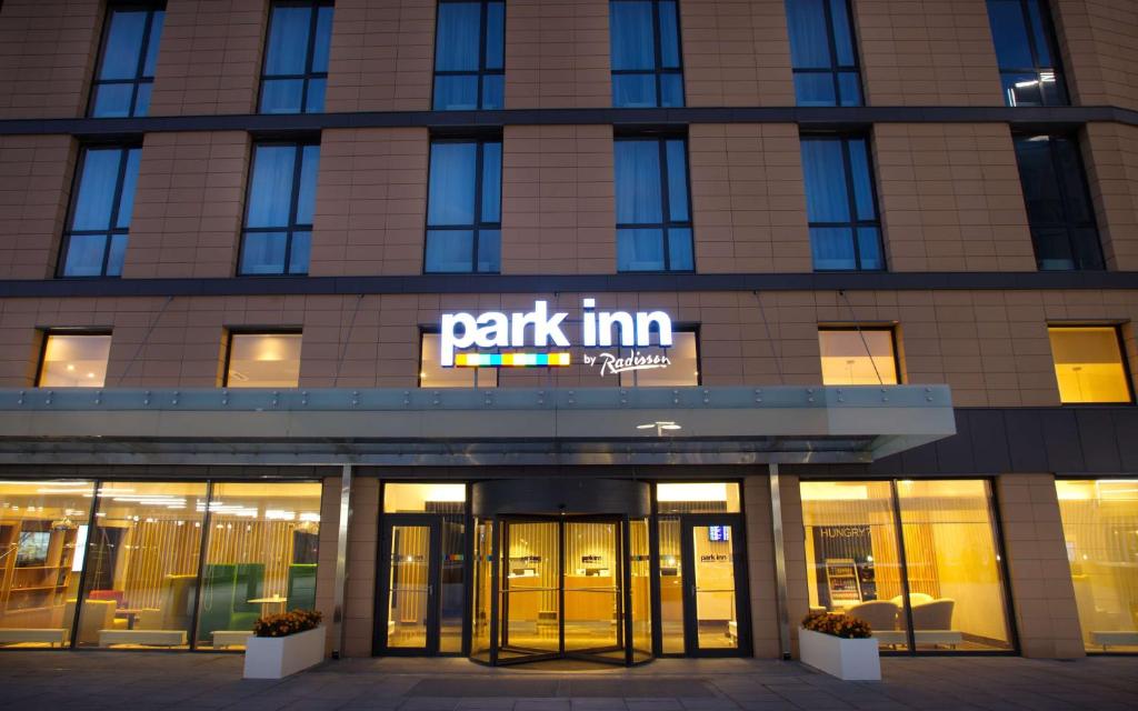 a building with a park inn sign in front of it at Park Inn by Radisson Pulkovo Airport in Saint Petersburg