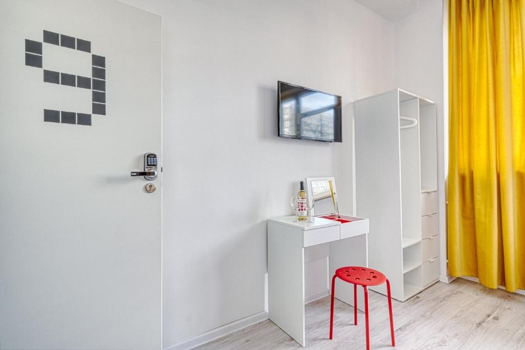 TV a/nebo společenská místnost v ubytování Level Rooms