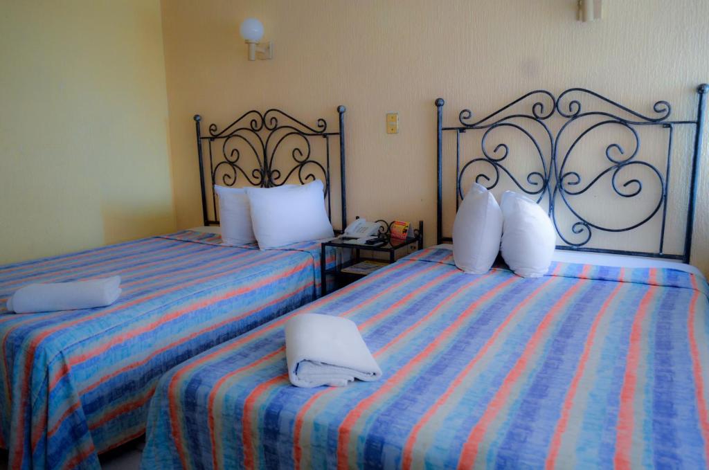 Postel nebo postele na pokoji v ubytování Hotel Terrasol