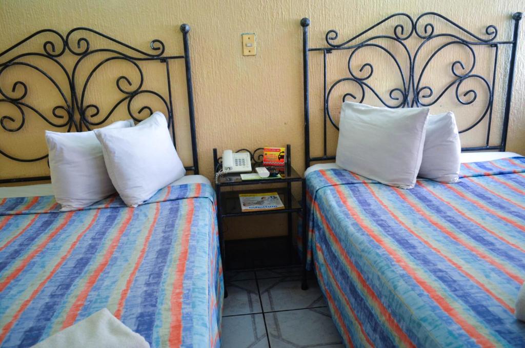 Postel nebo postele na pokoji v ubytování Hotel Terrasol