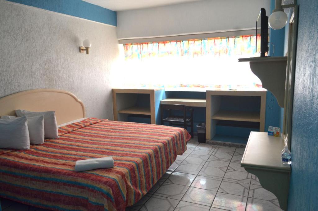 Postel nebo postele na pokoji v ubytování Hotel Terrasol