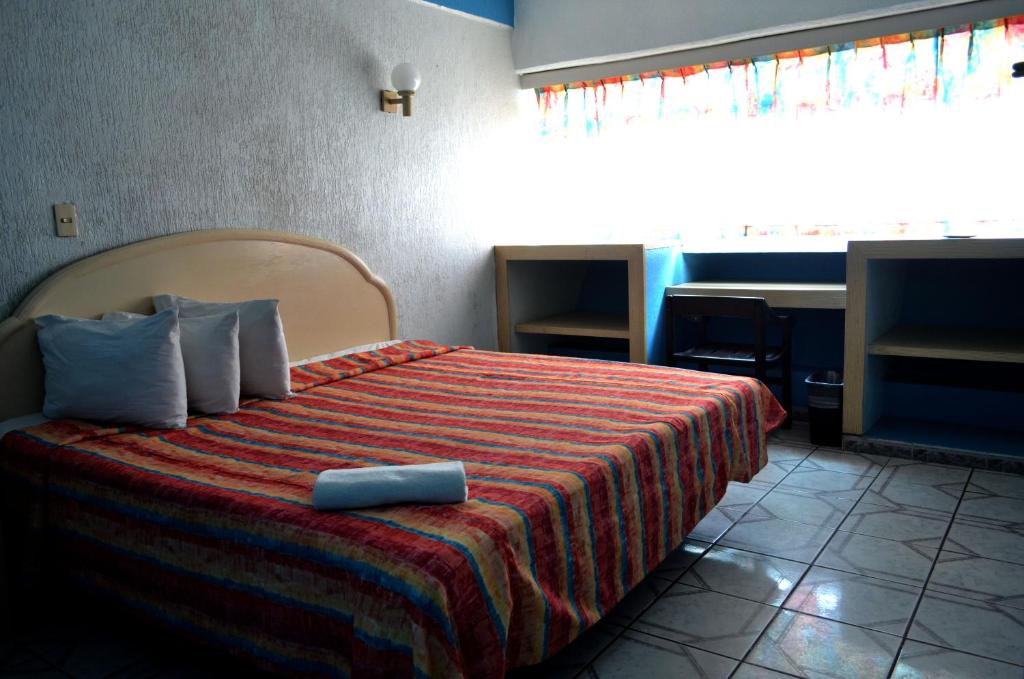 Postel nebo postele na pokoji v ubytování Hotel Terrasol
