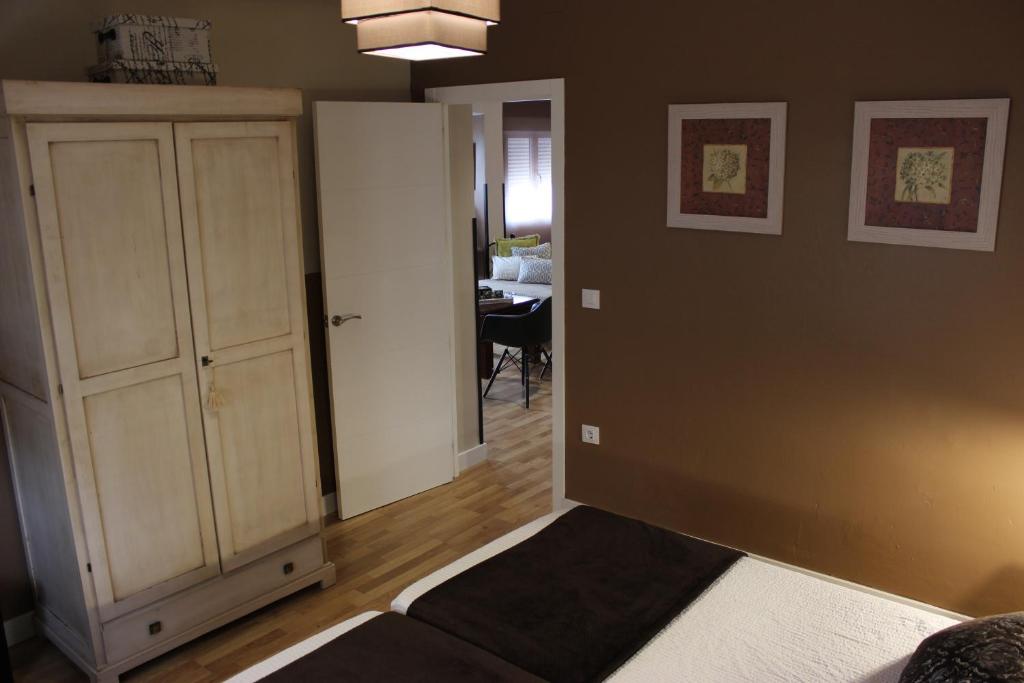 Posteľ alebo postele v izbe v ubytovaní Apartamentos Nundinae