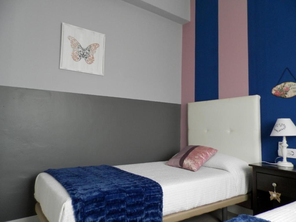 Posteľ alebo postele v izbe v ubytovaní Apartamentos Nundinae
