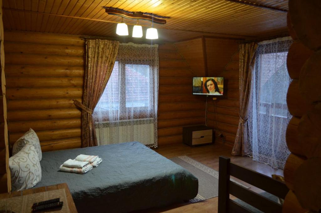 Postel nebo postele na pokoji v ubytování Sadyba Pikuy