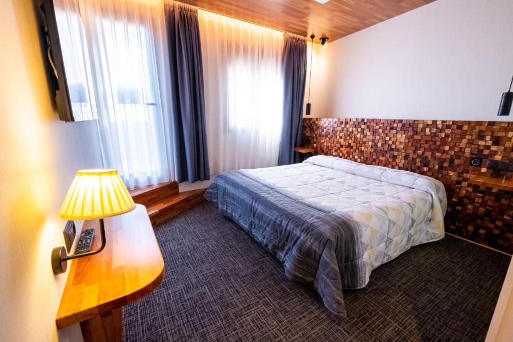 Cama o camas de una habitación en Far Home Bernabeu