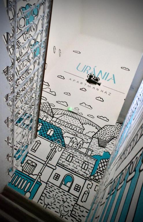 a book with a drawing of a city at Uránia Apartmanház in Eger
