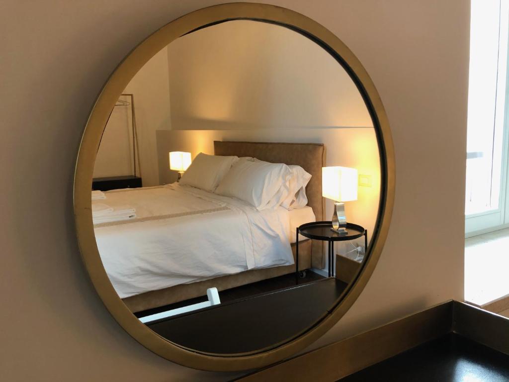 Ein Bett oder Betten in einem Zimmer der Unterkunft Palazzetto de Lante Appartamento Parione