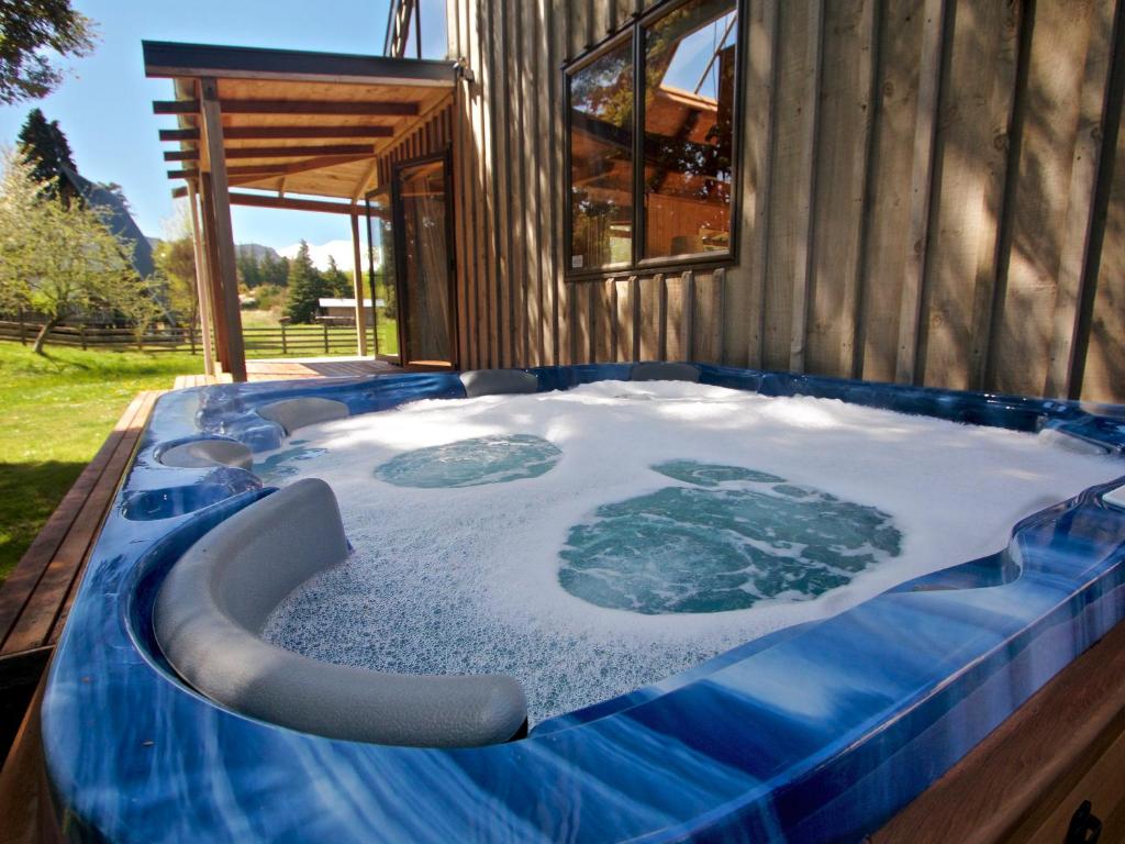 an igloo hot tub in a house with snow and ice at Ti Kouka Chalet - Ohakune Holiday Home in Ohakune