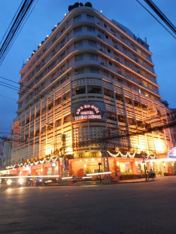 a large building is lit up at night at Thien Hong - Arc En Ciel Hotel in Ho Chi Minh City