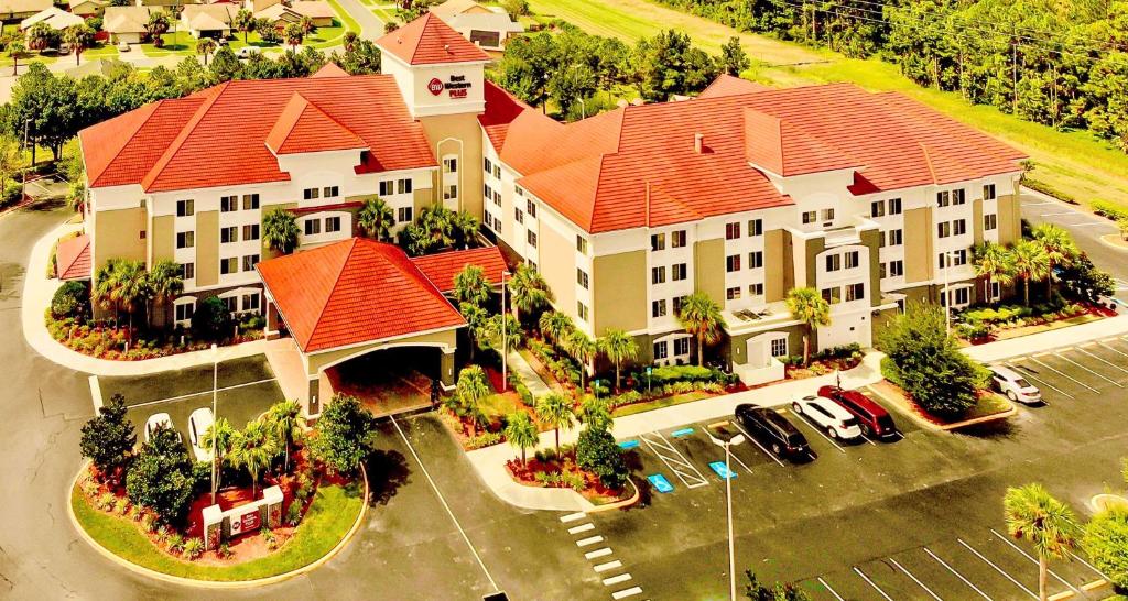 an overhead view of a large building with a red roof at Best Western Plus Kissimmee-Lake Buena Vista South Inn & Suites in Kissimmee