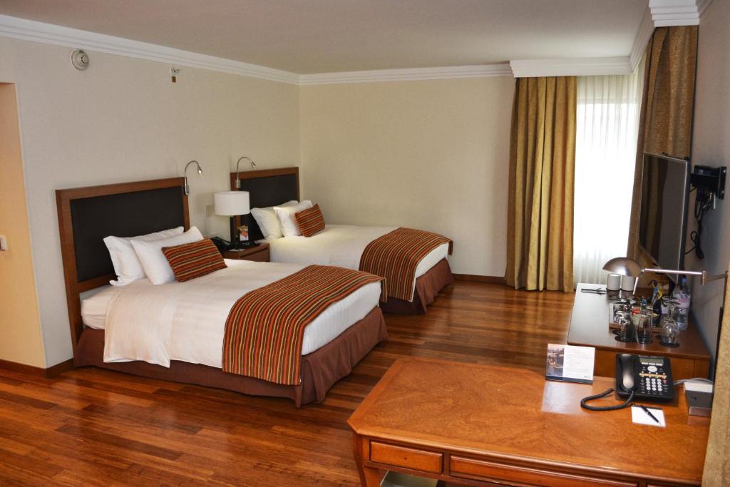 Una cama o camas en una habitación de Hotel Intercontinental Cali by IHG
