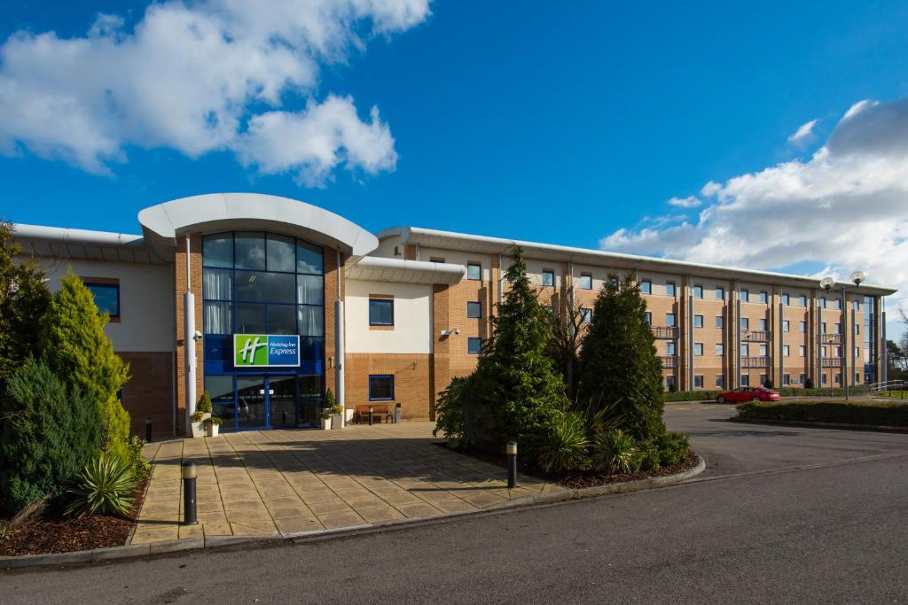 a large building with a large window at Holiday Inn Express Newport, an IHG Hotel in Newport