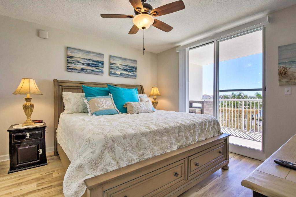 a bedroom with a bed and a ceiling fan at Snowbirds Retreat Walkable Destin Condo with View! in Destin