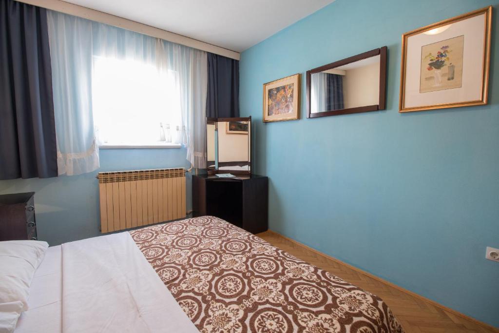Posteľ alebo postele v izbe v ubytovaní Apartment Kralj